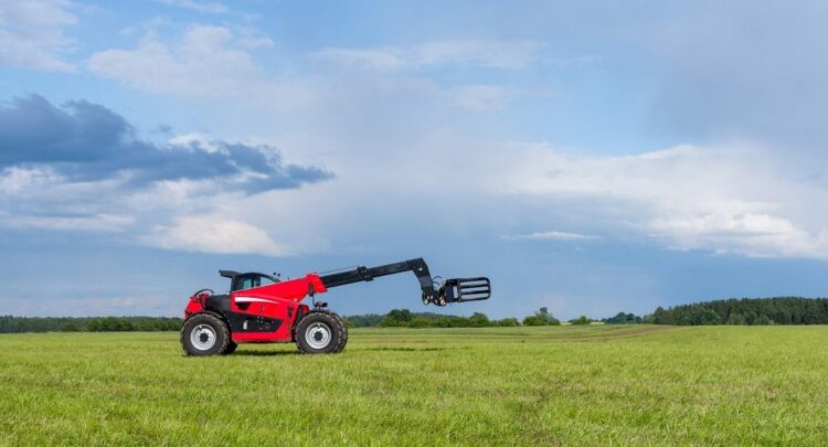 Red telescopic handler in the Lithuanian fields